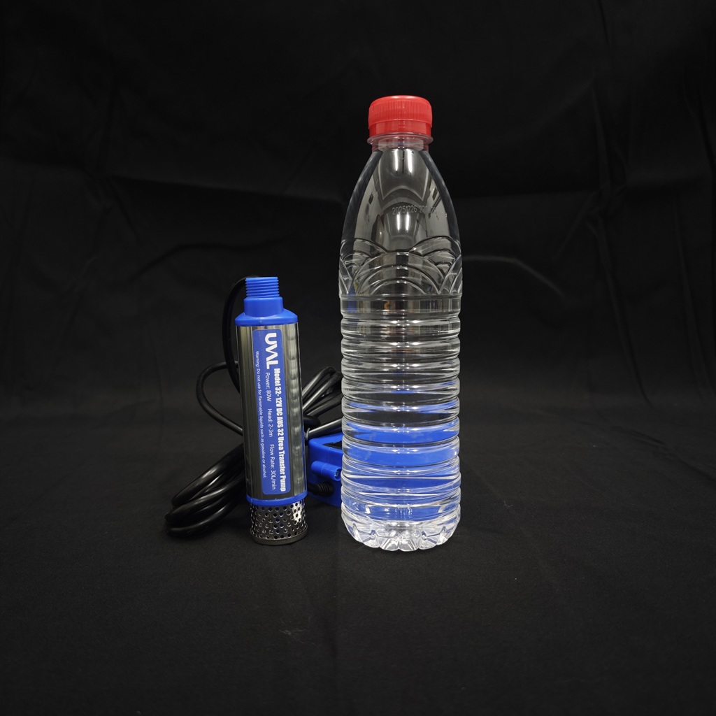 Model 32 mini pump shown beside a 550 ml bottle for scale